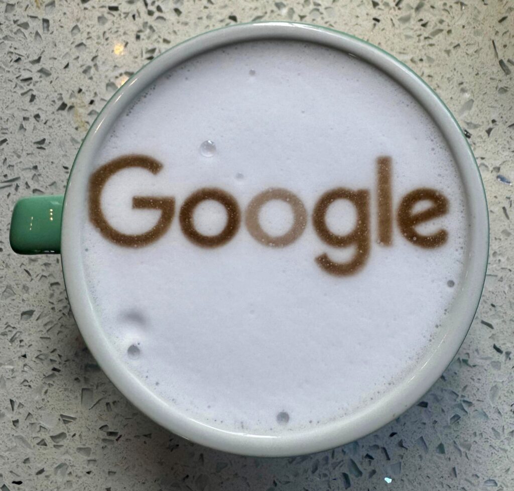 Google Google logo printed onto the milk foam of a latte by Tom’s Coffee at Google’s workplace coffee activation