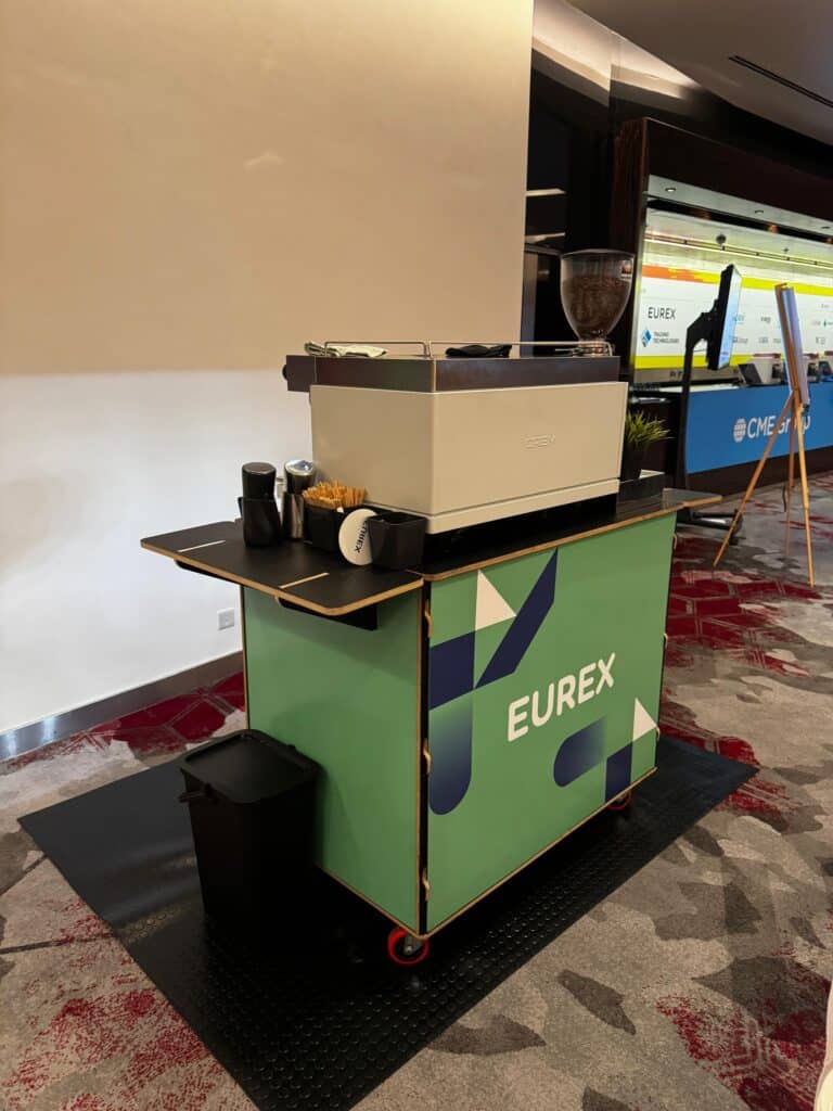 Eurex branded coffee bar by Tom’s Coffee in the exhibition hall at FIA IDX 2026