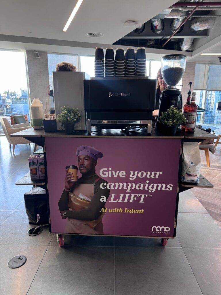 Branded office coffee bar by Tom’s Coffee with espresso machine, grinder and syrups at a staff event in a modern office