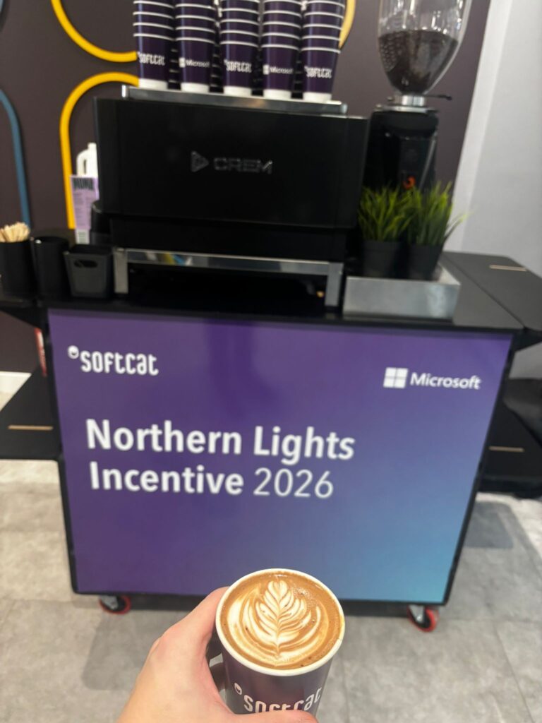 Softcat branded office coffee bar with branded takeaway cups and a fresh flat white at a Softcat and Microsoft incentive event