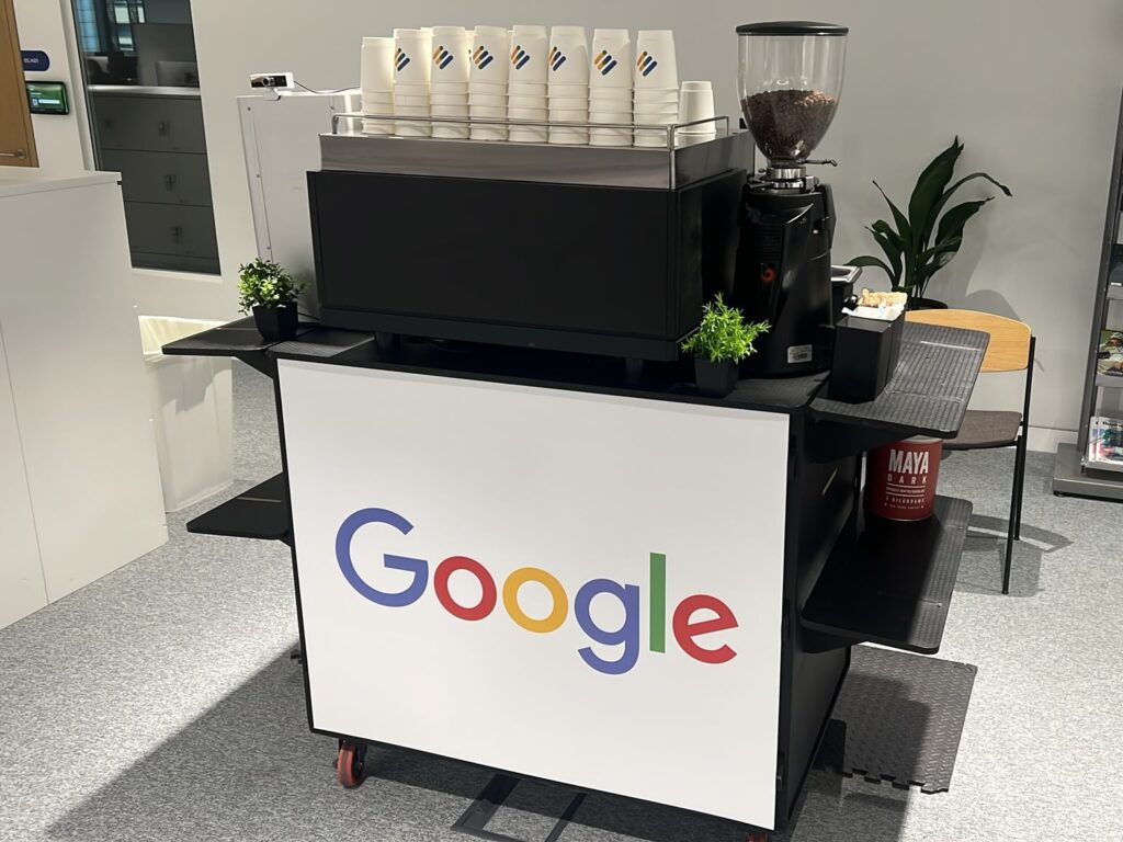 Google branded coffee bar Google-branded mobile coffee bar by Tom’s Coffee with espresso machine, grinder and branded cups at a workplace coffee activation